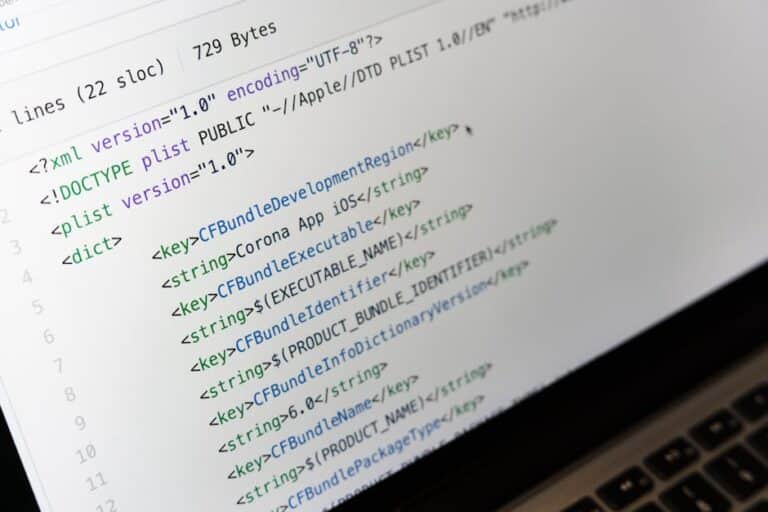 Detailed view of XML coding on a computer screen, showcasing software development and software due diligence